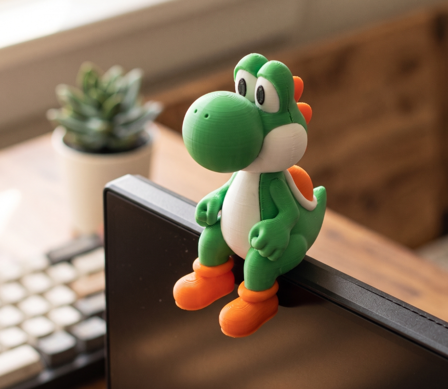 Cute Dino Monitor Buddy – Gamer Desk Companion Clip
